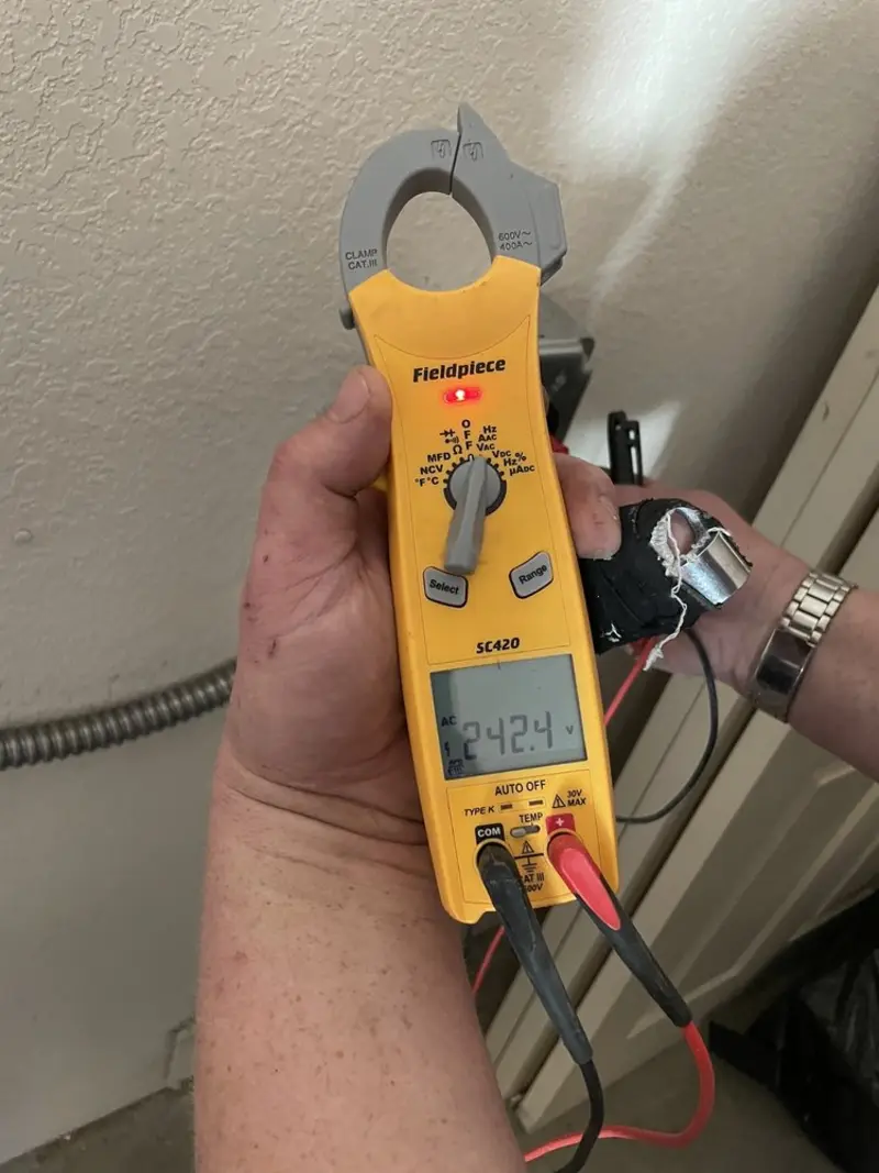 Voltage testing with clamp meter during Aluminum Wiring Replacement in Grenada